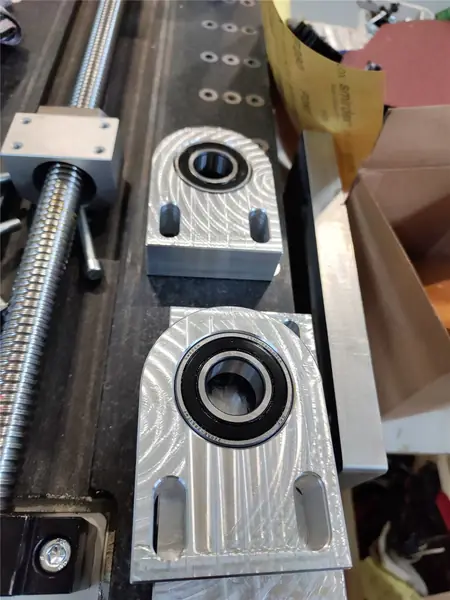 Ball screw supports on the base